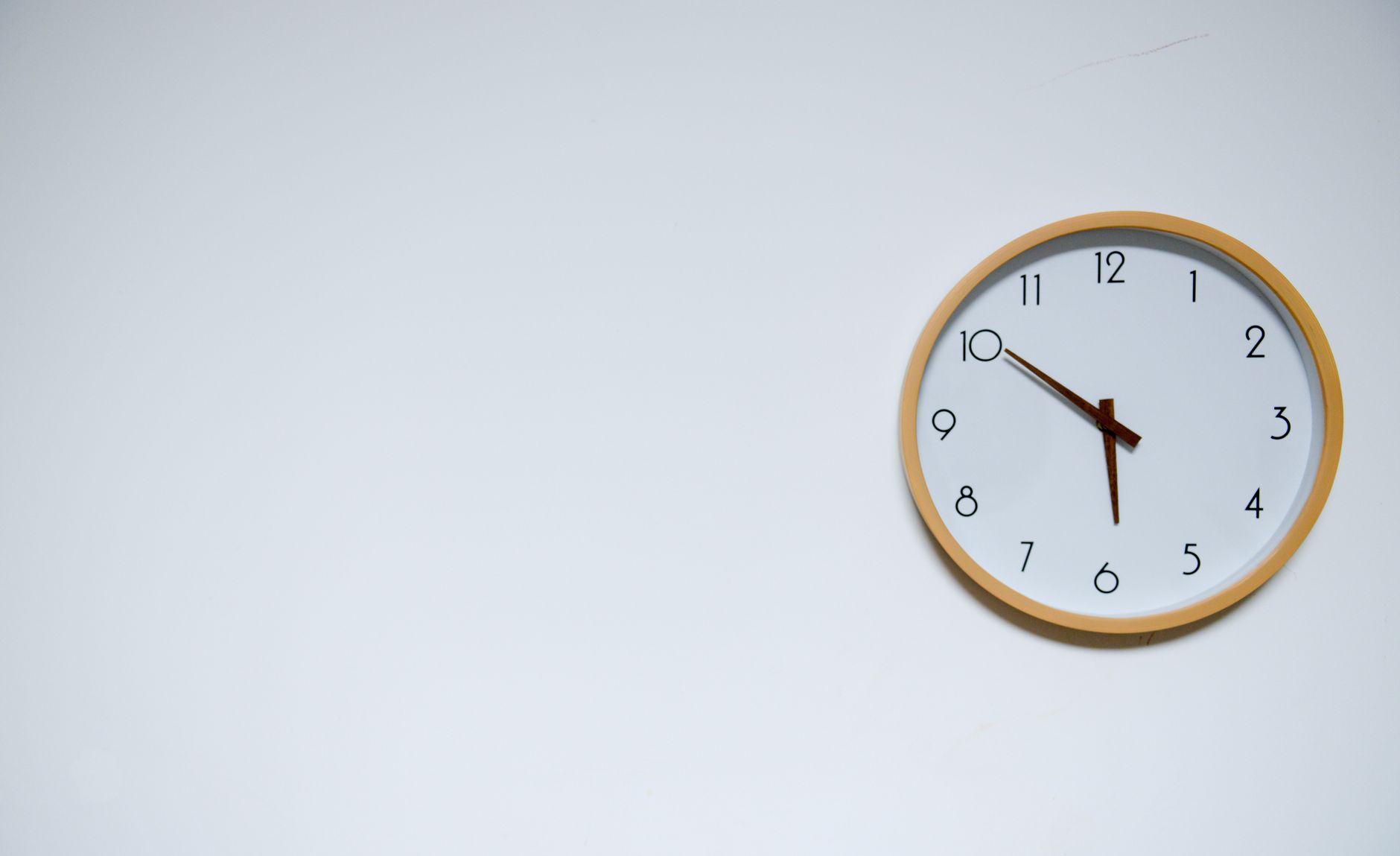 A round clock on an office wall.