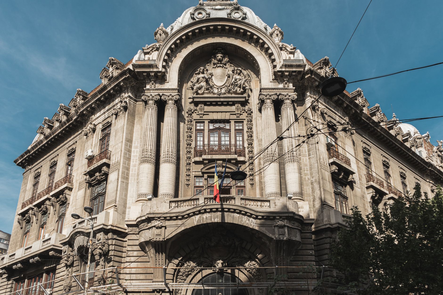A historic building facade on a street in Bucharest in daylight.