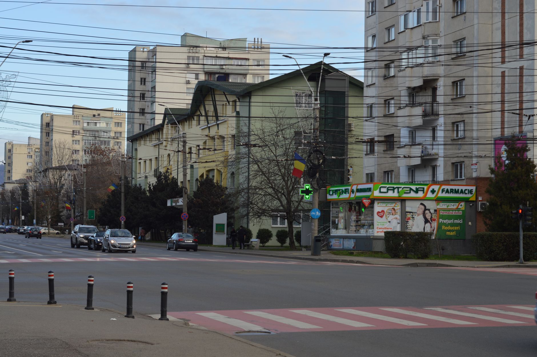A street lined with older buildings in Bucharest in daylight.